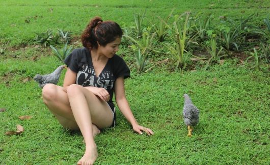student with chicken monteverde costa rica
