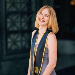 headshot of Rosemary with her graduation stole 