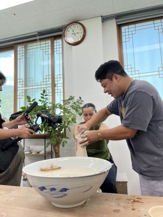 Perla trying out traditional ceramic making