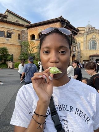 Picture of the author eating a Little Green Man Dumpling