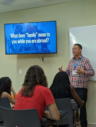 A CIEE staff member discusses with students what family means to them while abroad