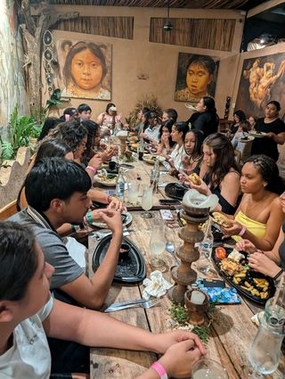 Students eat dinner at CONATO