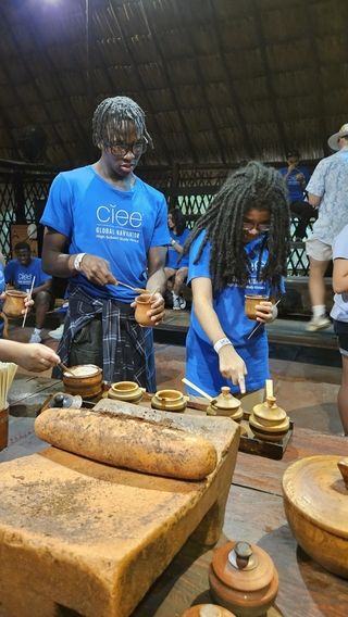 Students add mix-ins to their chocolate drink