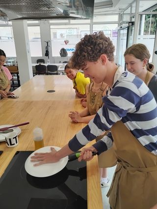 Jeff flips the partically cooked tortilla