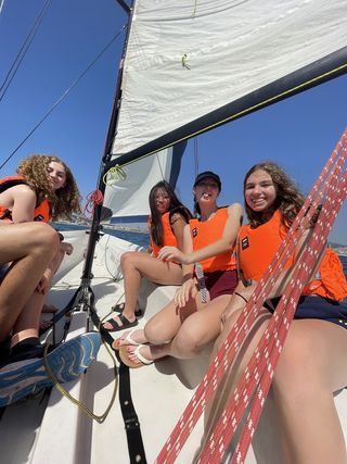 Students in life jackets on sailing summer adventure