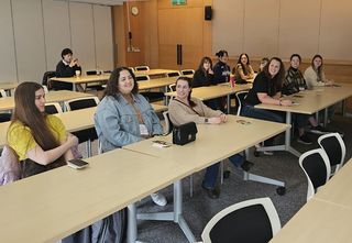 Teach in South Korea participants sitting together in a classroom