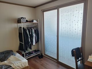 Teacher apartment in South Korea closet and bed