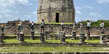 yucatan students standing ruins