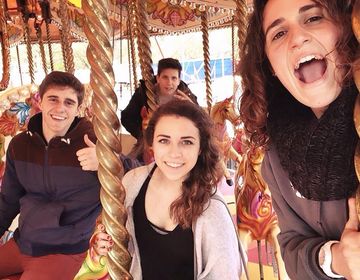 High school students having fun on a carousel at Funderland in Cork, Ireland