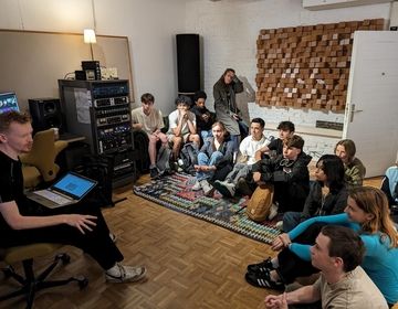 Students inside an audio recording studio