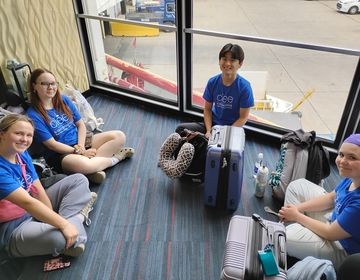 students getting to know each other at the airport