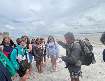 Our guide talking to students about the Bay of Mont St Michel