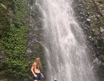 Ella in front of waterfall