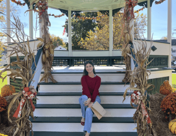 Emma sitting on gazebo