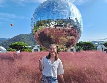 Sophie standing in front of the giant disco ball