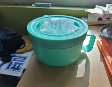 A picture of a bright blue soup container Tupperware