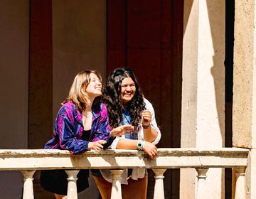 Students leaning against balcony at Convent in Portugal