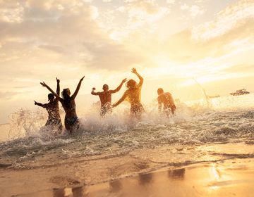 Students on program playing in the ocean