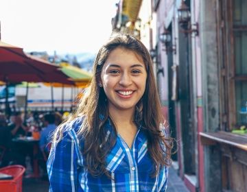 Young female student in city