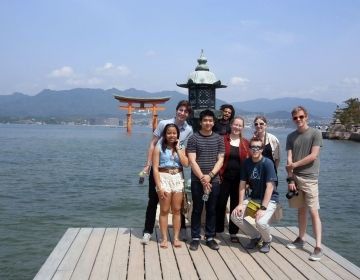 tokyo students on dock by ocean