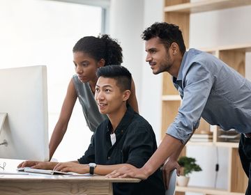 Interns on computer