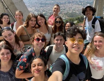 students abroad top of tower overlook