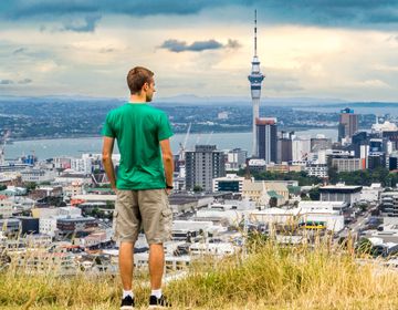 auckland man overlooking sky tower