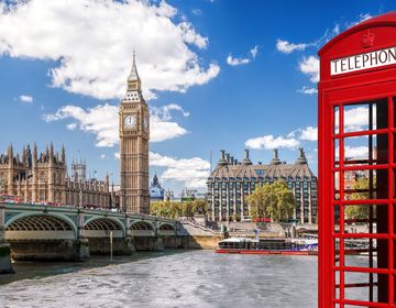 Phone booth by the side of the Thames River in London