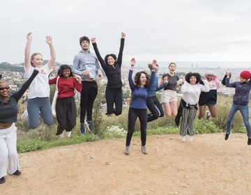 Program participants jumping in the air during excursion while studying abroad