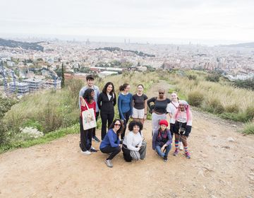 Group shot of students after a hike overlooking a city