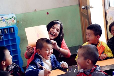 Teacher and young students in classroom in Thailand