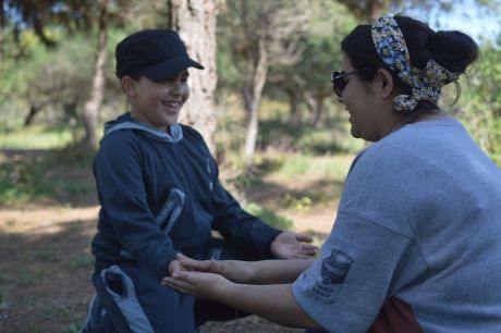 Young woman and kid playing a game in Rabat