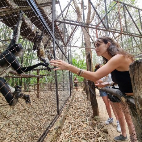 yucatan girl with a spider monkey