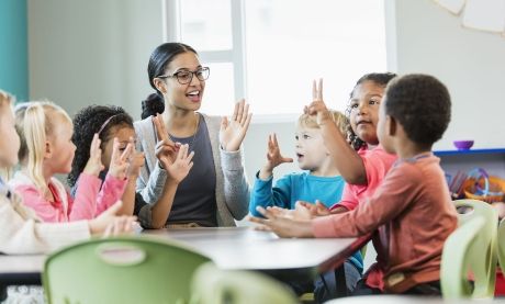 female teachers with young students