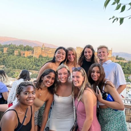 seville students posing for a photo overlooking a castle