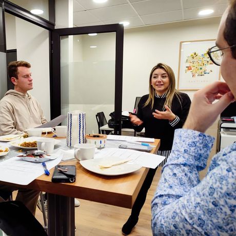 santiago intern students speaking with center director