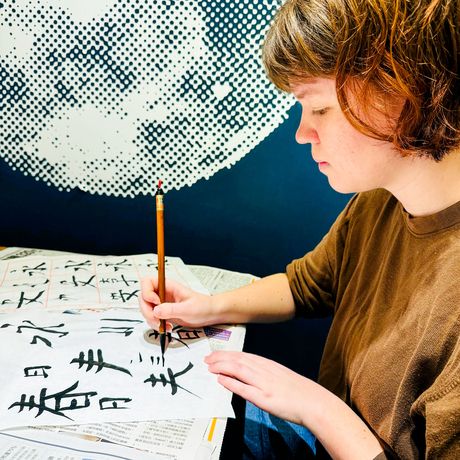 taipei student practicing calligraphy