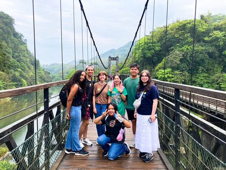 taipei students on bridge forest in background