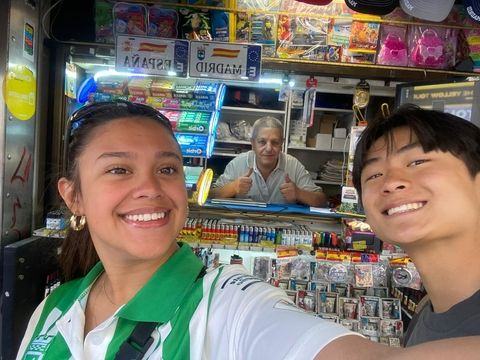 Lily and Matthew interviewing a kiosk owner