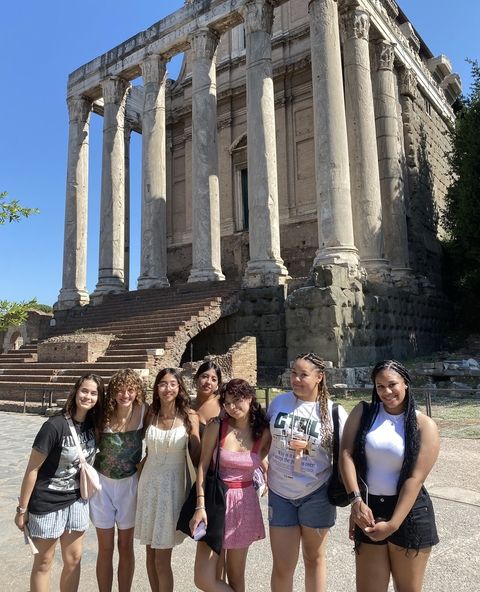 Students outside a Roman temple.