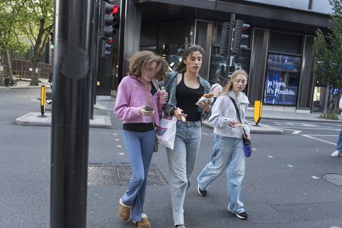 Students walking through a crosswalk abroad