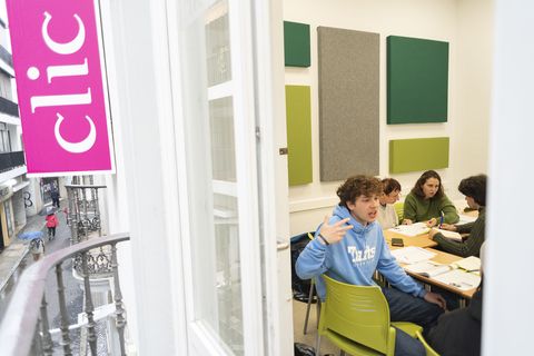 Students in classroom having a spirited discussion