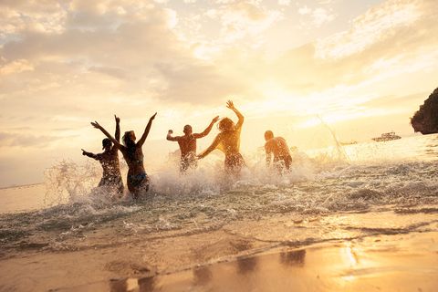 Students on program playing in the ocean