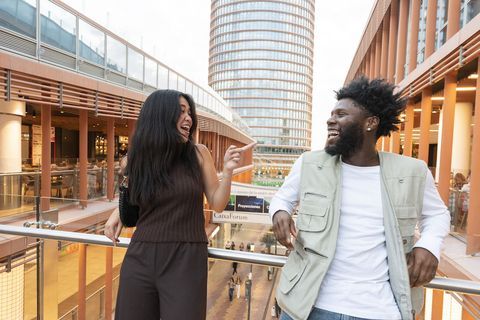 Students posing in shopping center while studying abroad