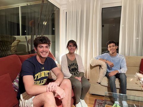 Students posing with host mom in Barcelona