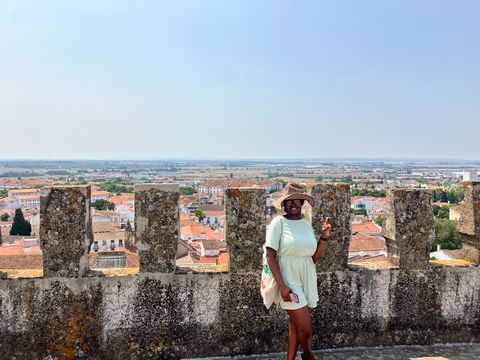 Student on a stone wall