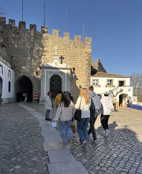 Students entering the medieval town of Óbidos