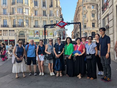 High school teachers posing in front of the Paris metro