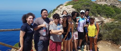 HIgh school students in Palma posing by water