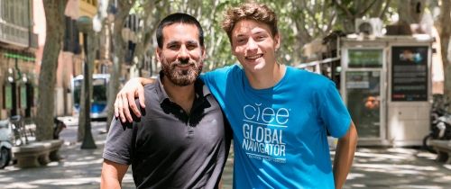 Teacher and student smiling on the street